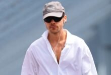 Harry Styles Strolls Into Late Summer in an Enormous White Shirt