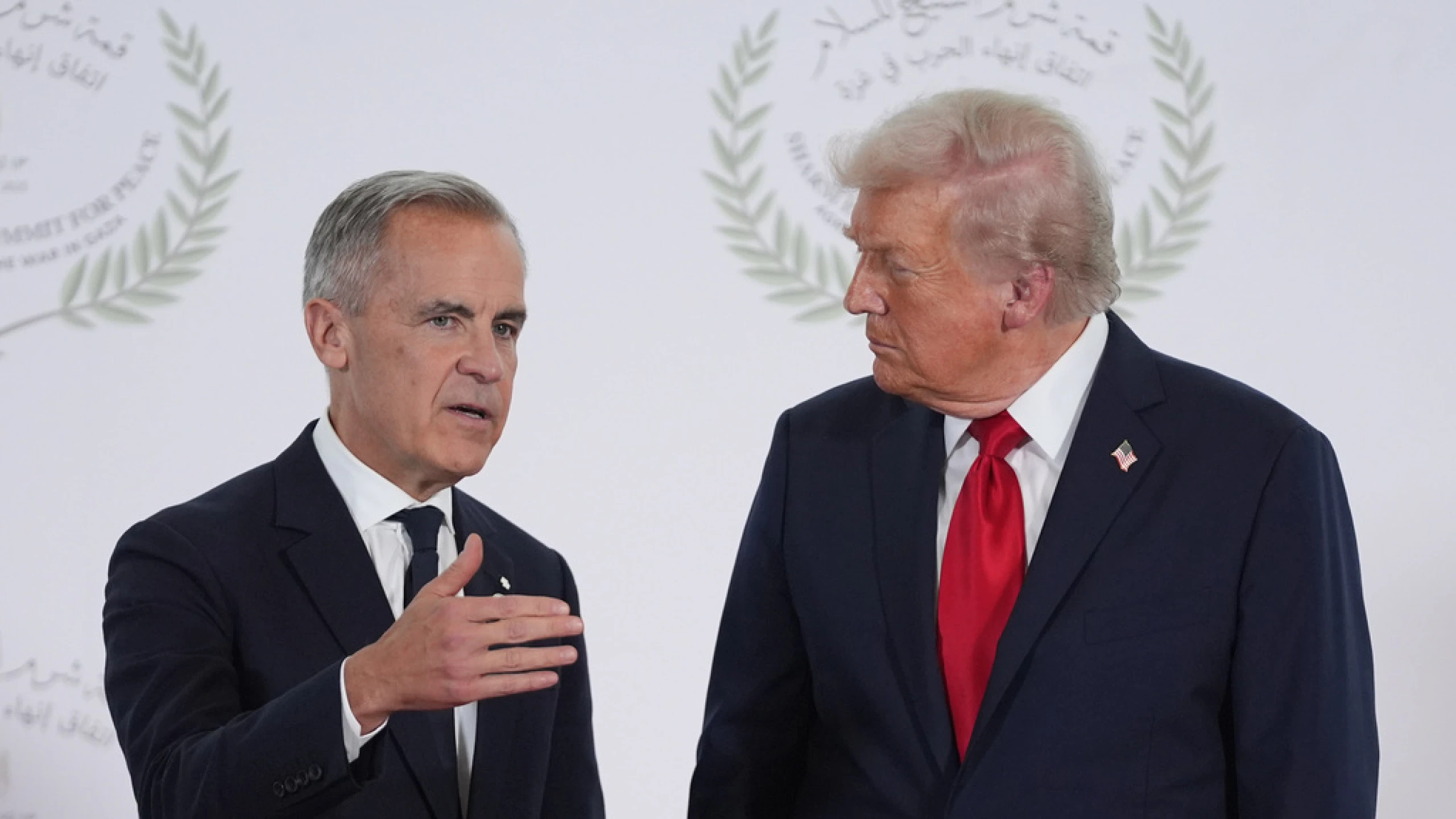President Donald Trump greets Canada's Prime Minister Mark Carney during a summit to support ending the more than two-year Israel-Hamas war in Gaza after a breakthrough ceasefire deal, Monday, Oct. 13, 2025, in Sharm El Sheikh, Egypt.