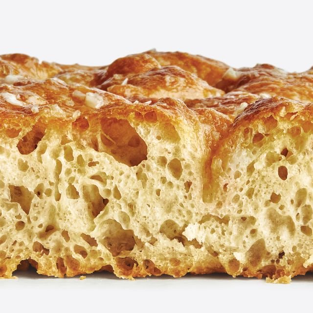 Freshly baked noknead focaccia brushed with garlic butter and sprinkled with flaky sea salt.