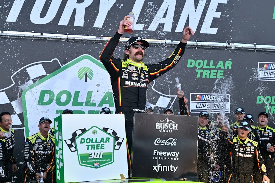 Aug 23, 2026; Loudon, New Hampshire, USA; Team Penske driver Ryan Blaney (12) celebrates winning the Dollar Tree 301 at New Hampshire Motor Speedway. Mandatory Credit: Eric Canha-Imagn Images