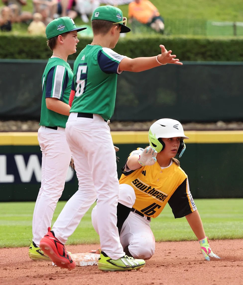 Runner Kinley Rasmus of Phenix, AL (Southeast Region) is safe at second base against Tacoma, WA (Northwest Region) at the   L