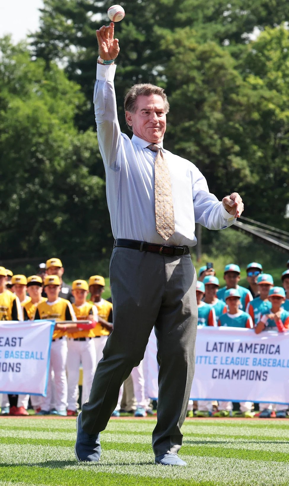 Legendary baseball player Steve Garvey throws out the first pitch during opening ceremonies at the Little League Baseball Wor