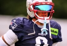 Gonzalez focused on season, but irked by talks with Patriots