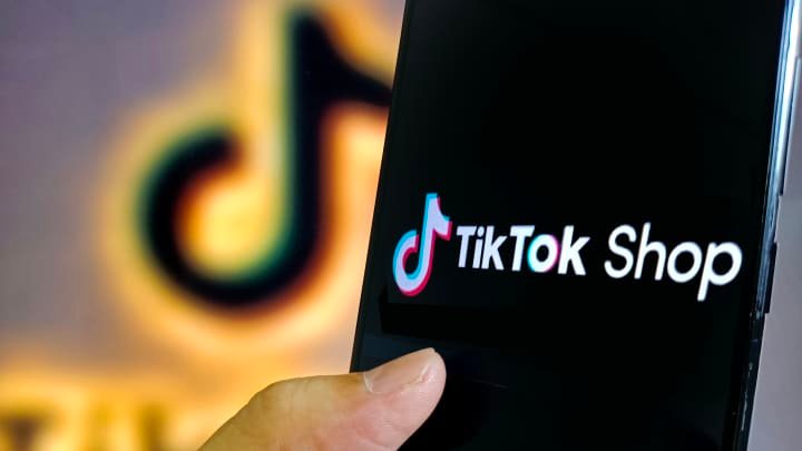 TikTok Shop logo on a smartphone.
