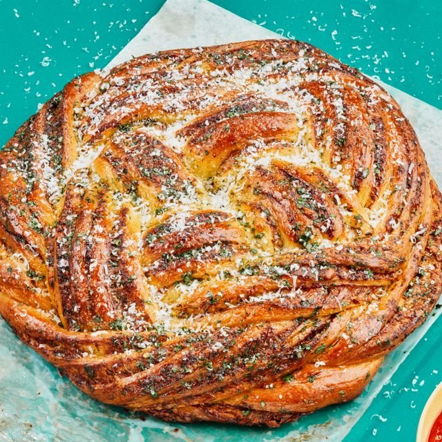 Beautifully baked Garlic Knot Babka on parchment paper as