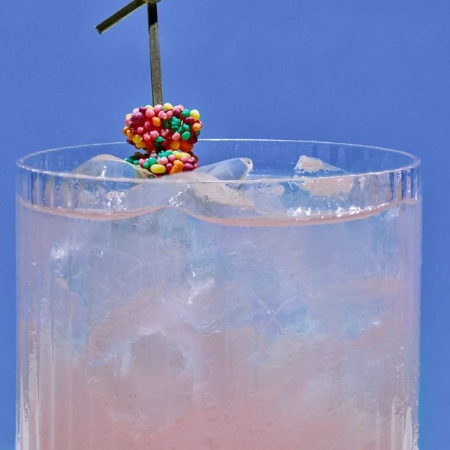 A close up of a drink against  blue background