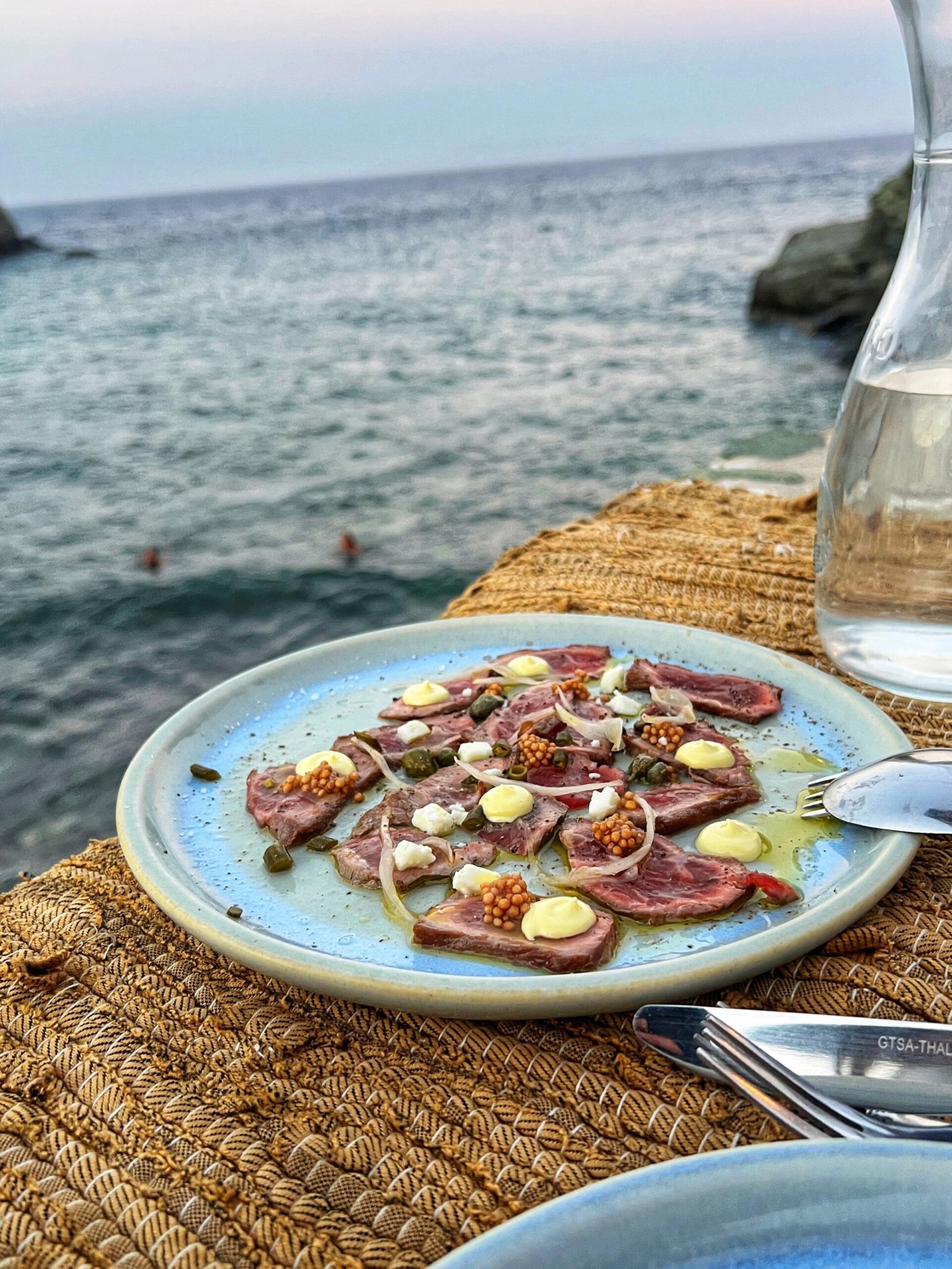 Thinly-sliced local beef carpaccio with garum-mayo, and pickled mustard seeds from the zero-waste restaurant Cantina.