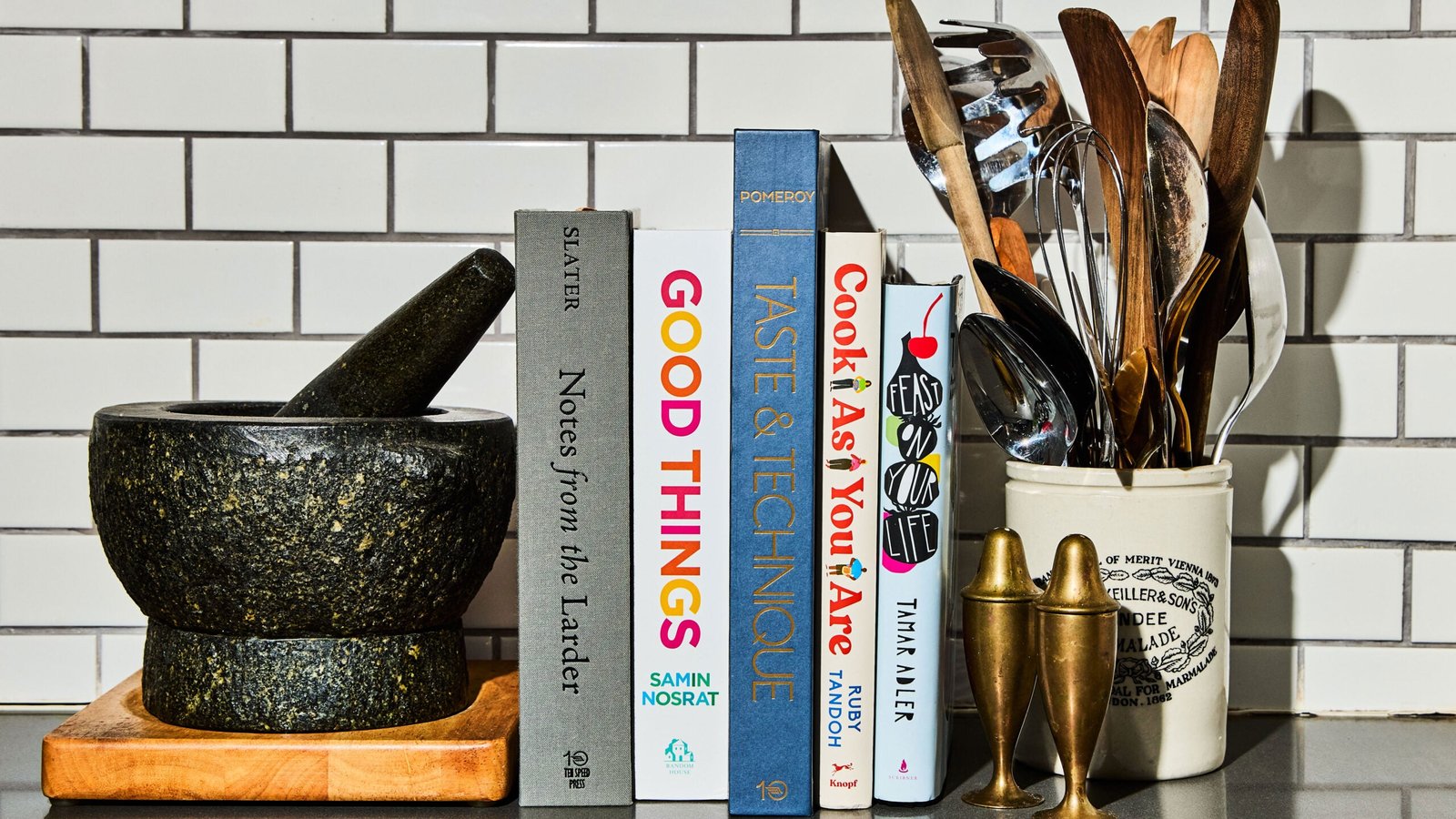 These Cookbooks Explore the Link Between Mindful Cooking and Self-Care A stack of cookbooks in a kitchen