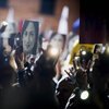 Demonstrators raise pictures of slain journalist Daphne Caruana Galizia during a demonstration in 2019.