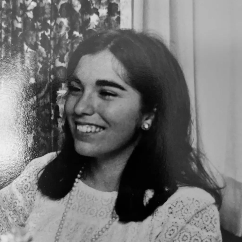 Black and white image of a smiling Lisa Kushner in 1967.