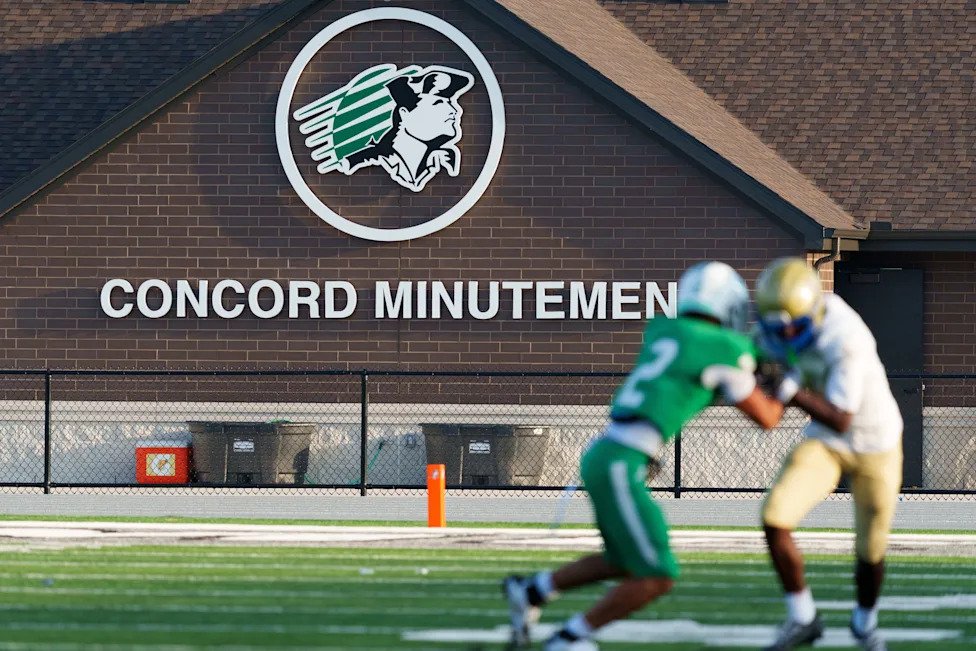 The locker room is seen in the background during an IHSAA football game between Concord and Elkhart at Concord High School on