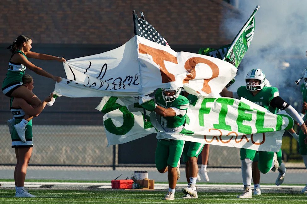 Concord takes the field before an IHSAA football game between Concord and Elkhart at Concord High School on Friday, Aug. 21, 