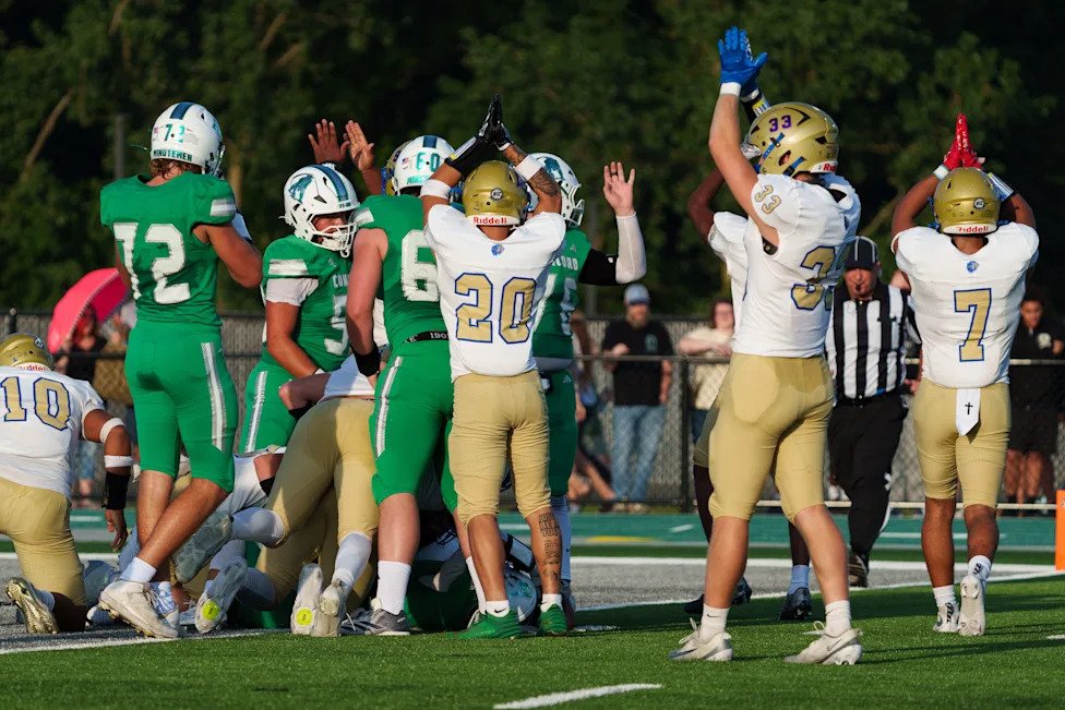 Elkhart celebrates scoring a safety during an IHSAA football game between Concord and Elkhart at Concord High School on Frida