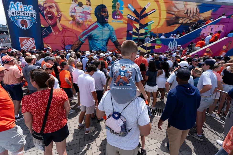 Fans make their way to the game before Auburn Tigers take on Baylor Bears in the Aflac Kickoff Game at Mercedes-Benz Stadium 