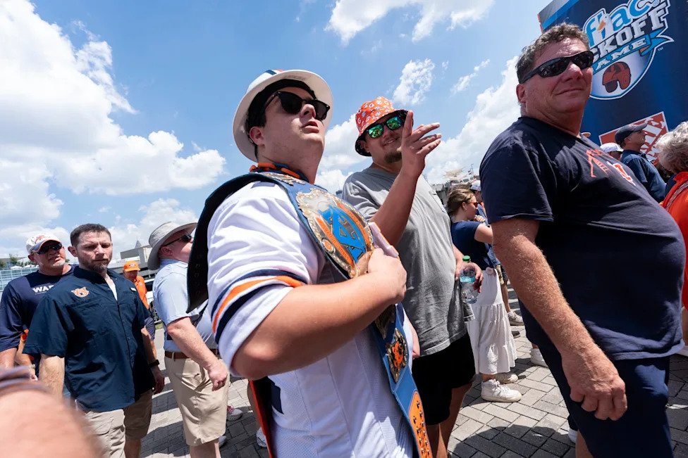 Fans make their way to the game before Auburn Tigers take on Baylor Bears in the Aflac Kickoff Game at Mercedes-Benz Stadium 