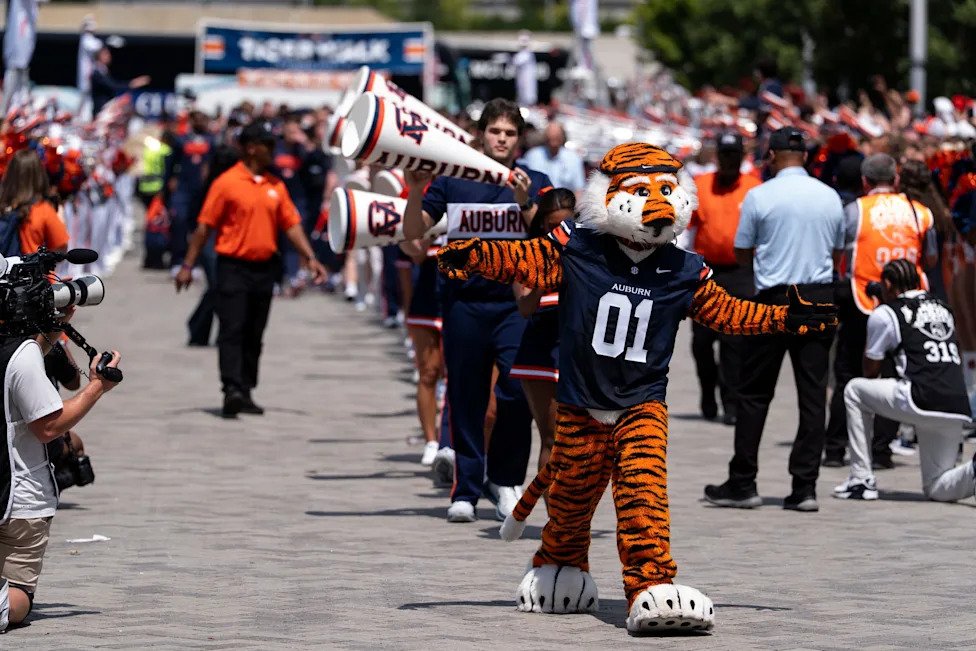 Aubie greets fans during Tiger Walk before Auburn Tigers take on Baylor Bears in the Aflac Kickoff Game at Mercedes-Benz Stad