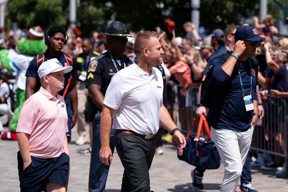 Auburn Tigers head coach Alex Golesh arrives with his team before Auburn Tigers take on Baylor Bears in the Aflac Kickoff Gam