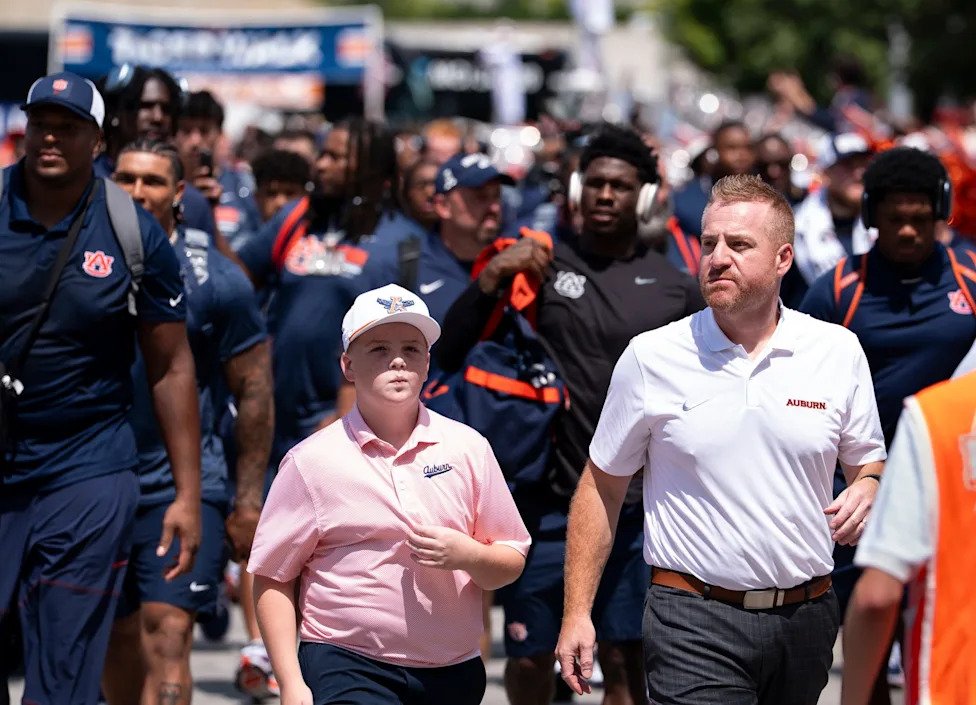Auburn Tigers head coach Alex Golesh arrives with his team before Auburn Tigers take on Baylor Bears in the Aflac Kickoff Gam