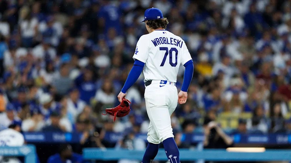 Justin Wrobleski #70 of the Los Angeles Dodgers walk off the field during the game against the Washington Nationals at Dodger Stadium on September 6, 2026 in Los Angeles, California.