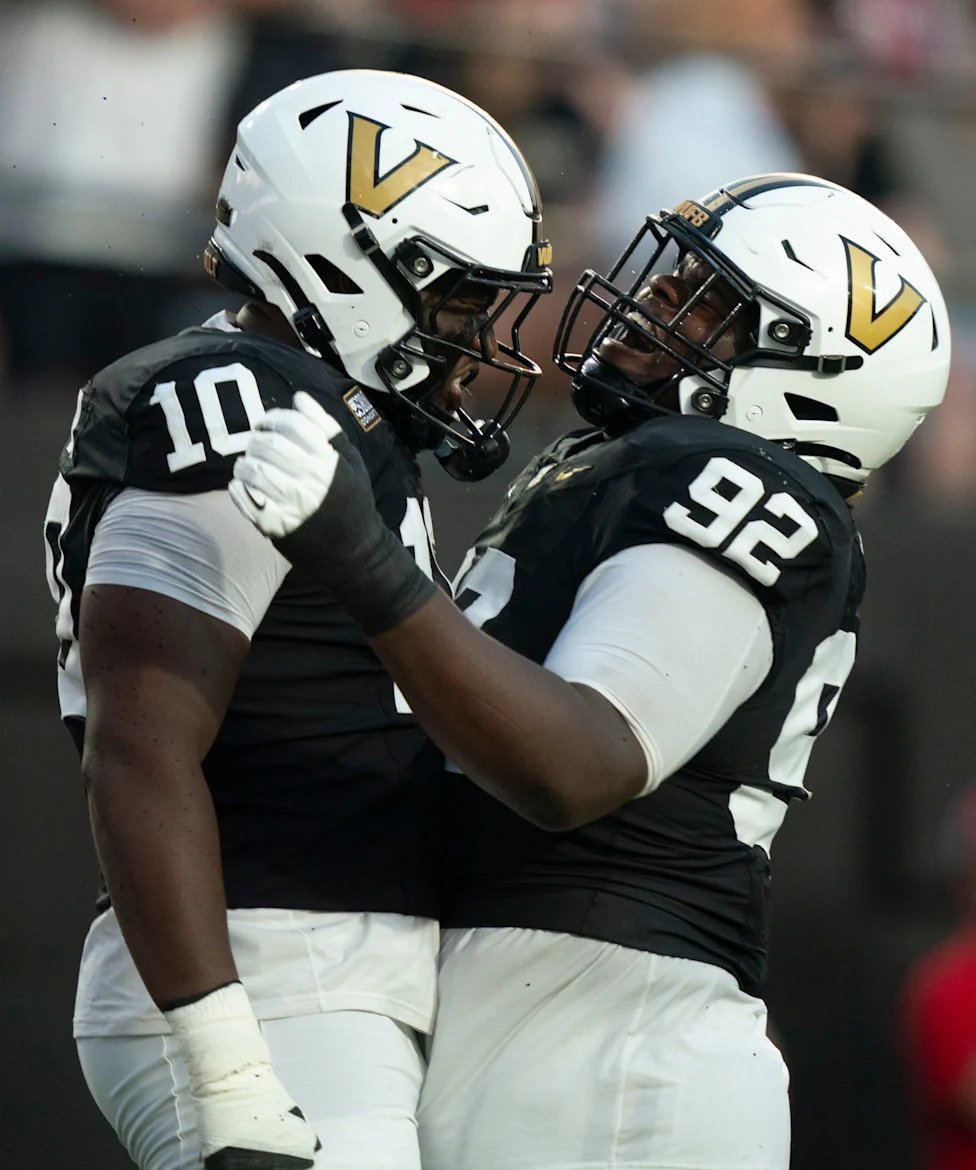 Vanderbilt defensive end Brian Allen (10) and defensive lineman Jaylon Stone (92) celebrate a sack against Austin Peay quarte