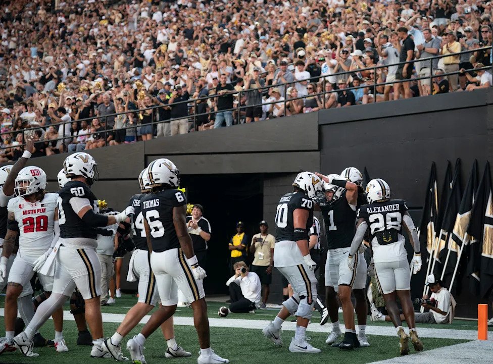 Vanderbilt quarterback Blaze Berlowitz (1) celebrates his running touchdown against Austin Peay during their game at FirstBan