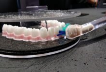 I flossed fake teeth with Dyson’s tech-riddled CameraJet toothbrush