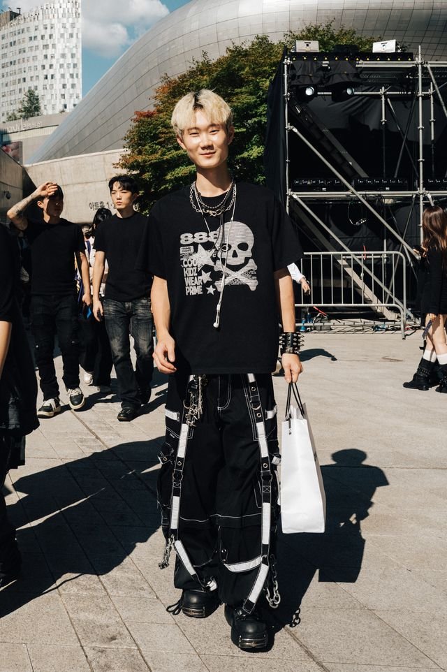 Image may contain Clothing TShirt Person Teen Adult Jeans Pants Accessories Bag Handbag Footwear and Shoe