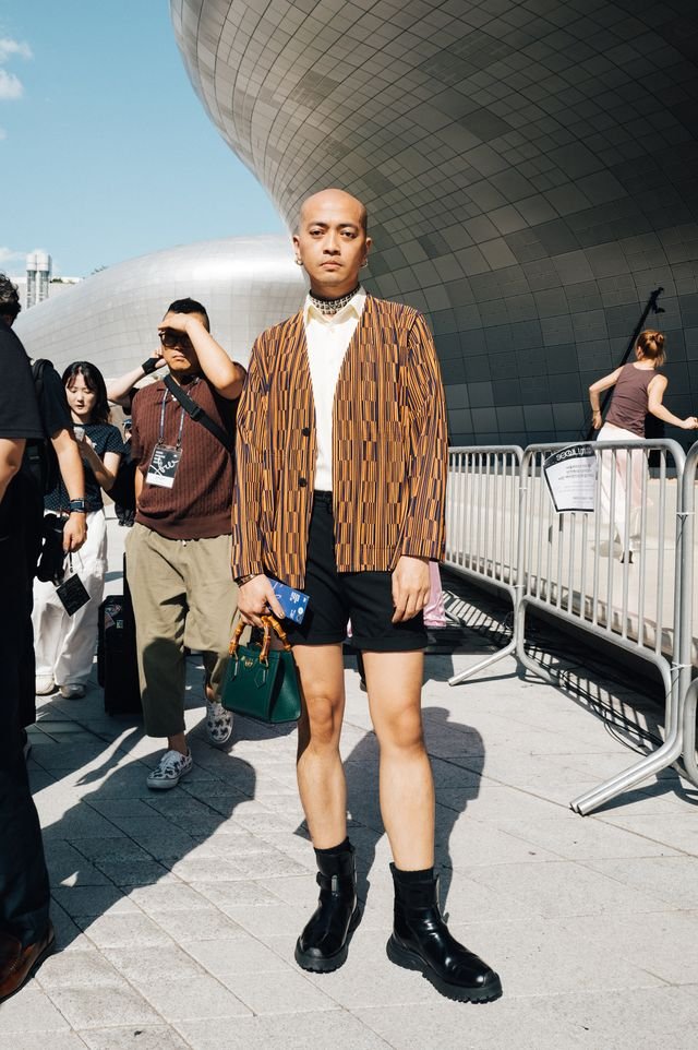 Image may contain Choi Donghun Clothing Shorts Adult Person Coat Footwear and Shoe