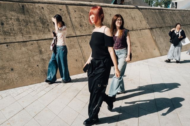 Image may contain Nana Kitade Clothing Pants Adult Person Teen Jeans Photobombing Brown Hair and Hair