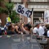 A demonstrator holds up an "8647" sign at a "No Kings" protest in Louisville, Ky., in June 2025.